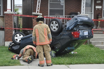David Ritchie, Special to The Spectator Two cars collided on Paling Avenue near Britannia Avenue in east Hamilton just before 4 p.m. Monday, sending a VW Jetta off the road.