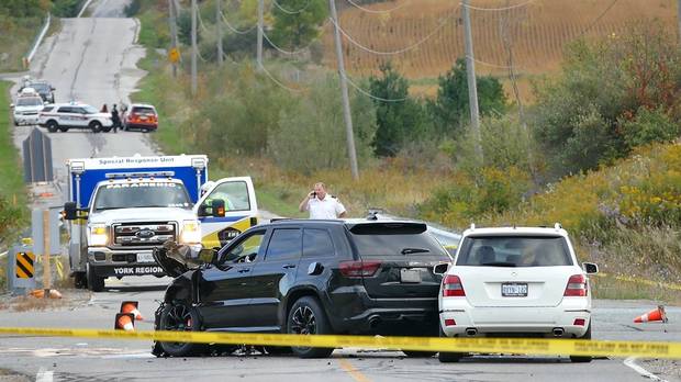 Police investigate the scene after a fatal car accident in Vaughan, Ont., north of Toronto, on Sept. 27. (Pascal Marchand/THE CANADIAN PRESS)