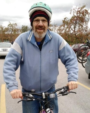A picture of Jay Keddy on his bicycle.
