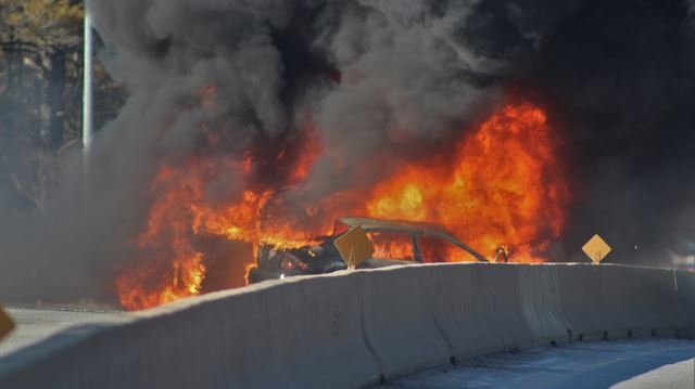 Fatal accident Michael Donly/Metroland Media Flames engulf a vehicle on Highway 11 in Bracebridge.