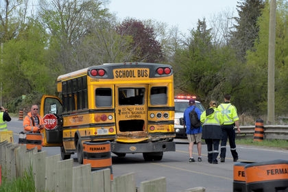 Seven children were taken to hospital, at least two seriously, after a collision between a school bus and a tanker truck on Steeles Ave. and 6th Line in Milton. (Andrew Collins/Special to the Toronto Sun)