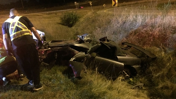 A vehicle lies in the ditch on the side of Highway 410 near Williams Parkway in Brampton Monday, August 22, 2016. (Mike Nguyen /CP24)