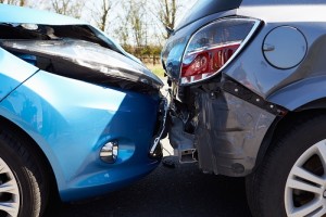 Two cars are pictured in a rear-end collision.